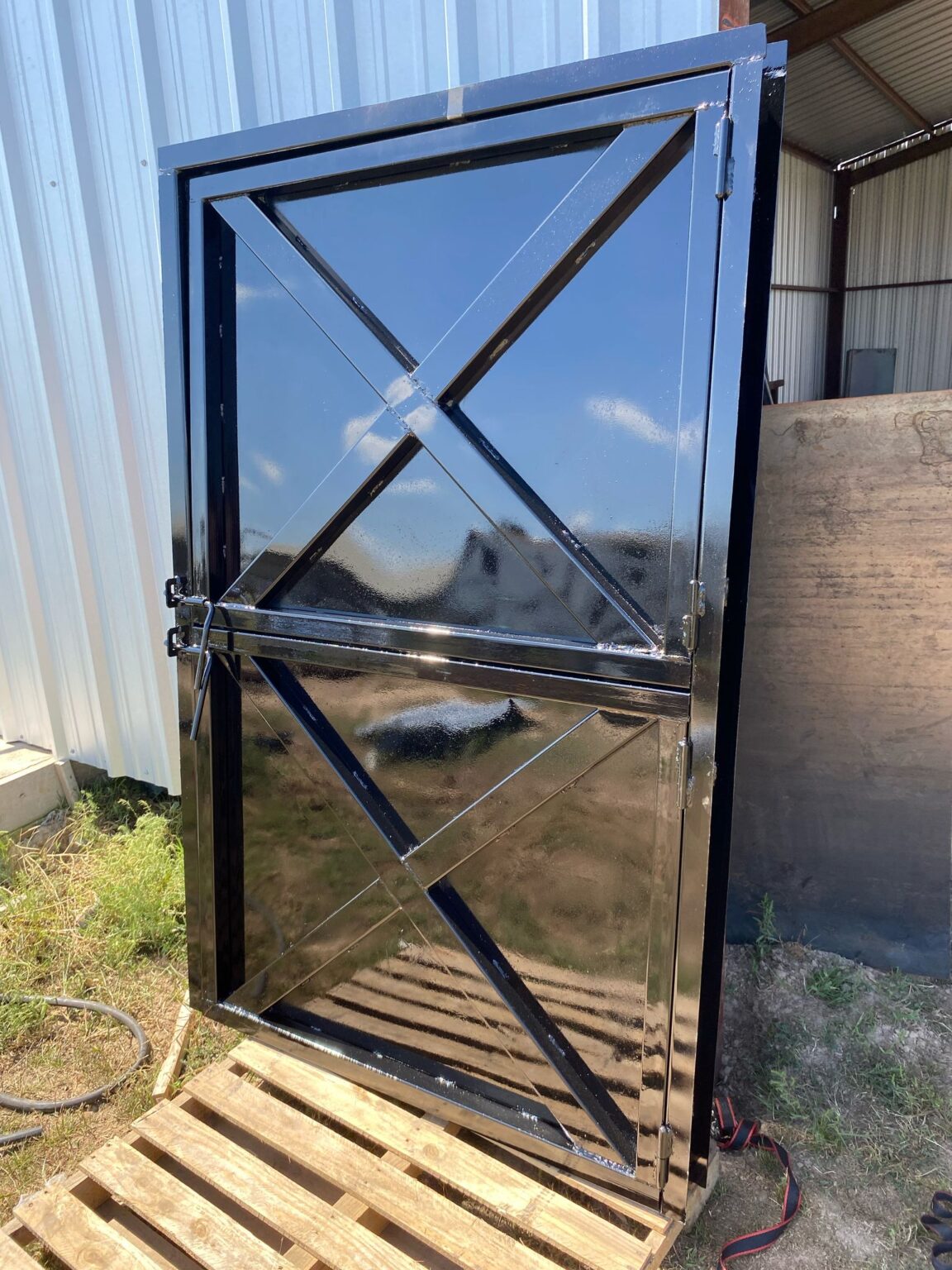 Gloss-black Dutch door with welded X-brace panels